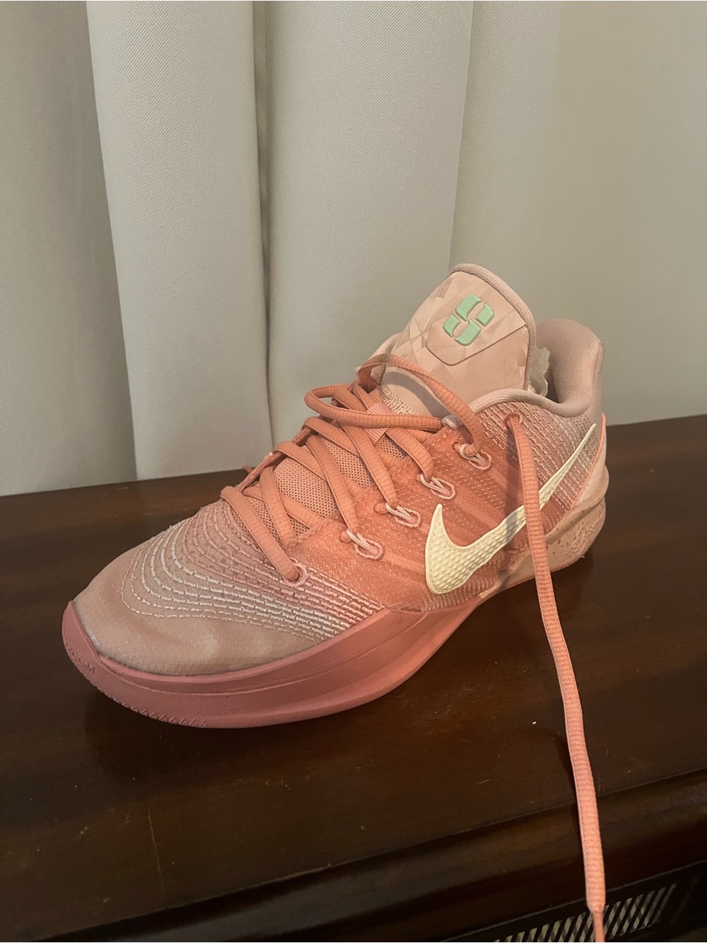 Nike Women's Coral Pink Athletic Tennis Shoe with White Swoosh